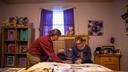 Lauren Zak, a direct support professional for Emmaus Community of Pittsburgh, helps Emmaus resident Diane change her sheets.