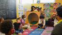 Tanisha Baylor (right) during “circle time” with the 4-year-old students under her care at The Willow School. The Montgomery County center for children has been significantly impacted by staffing shortages.