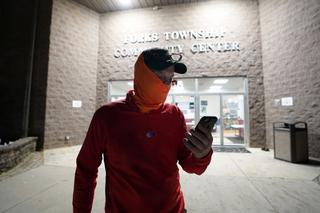 Edward Holley, of Forks Township, talks to friends on the phone after being the last person to vote at Forks Township Community Center on Nov. 3, 2020, in Forks Township, Northampton County, Pennsylvania.